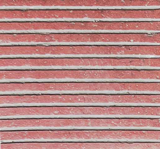 거친 질감에 촘촘한 흰색 줄무늬가 있는 붉은 색의 벽돌 타일이다.