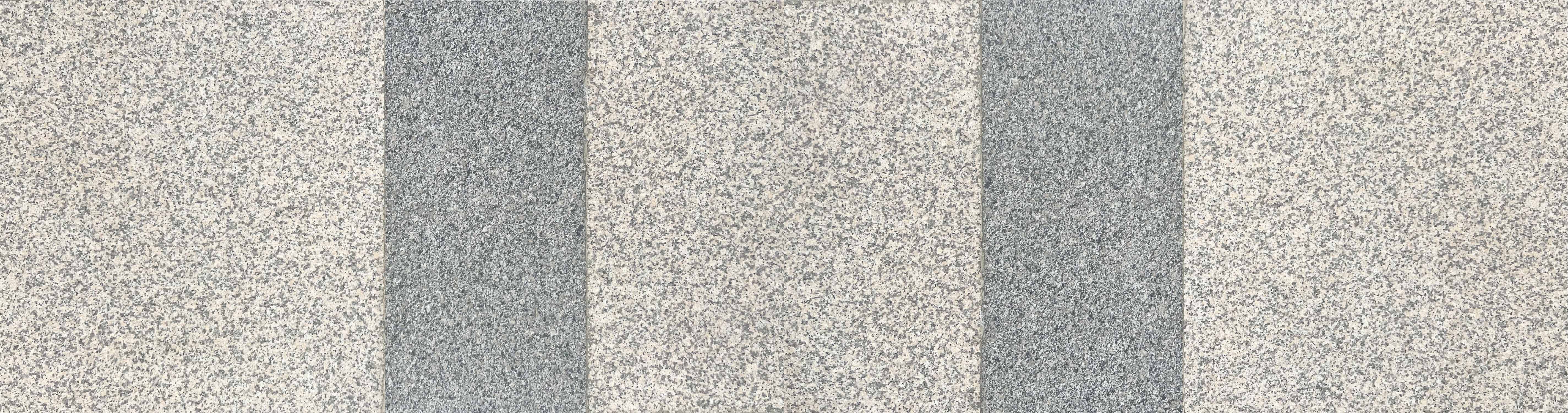 전체적으로 연한 회갈색 바탕에 어두운 색의 점박이 무늬가 있는 타일이다. 중간에 같은 재질의 어두운 푸른 회색의 타일이 세로로 2개가 나란히 있는 바닥 사진이다.