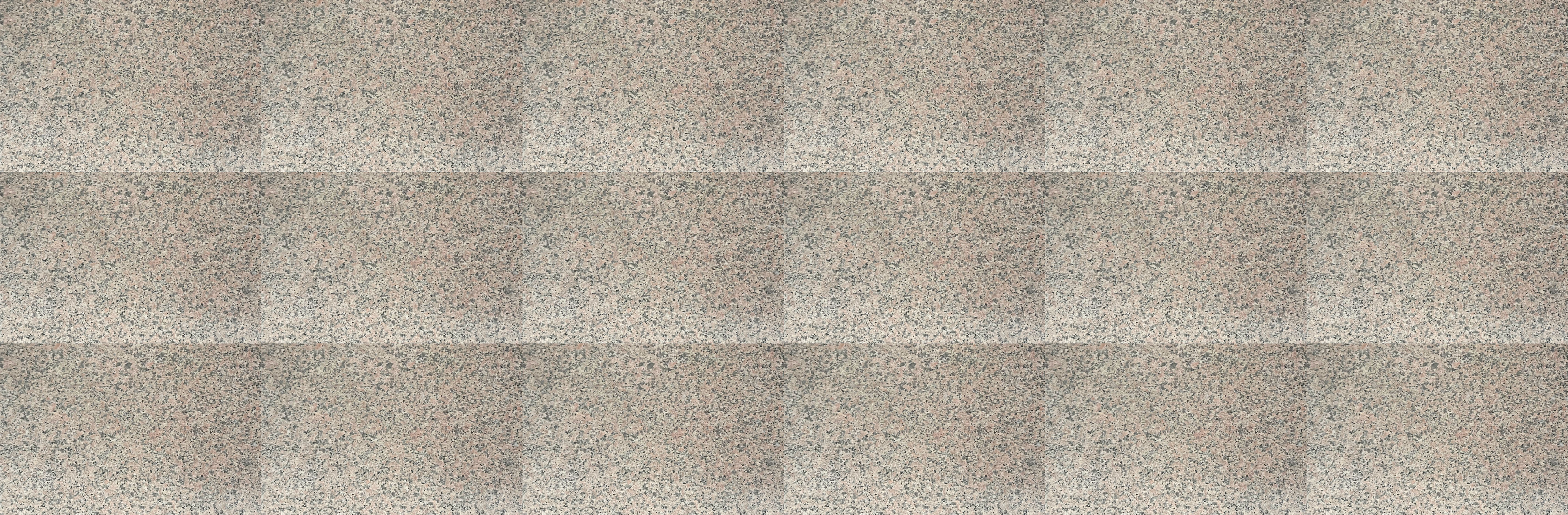 연갈색 바탕에 오묘한 붉은 빛과 어두운 회갈색의 점박이 무늬를 가진 타일로 이루어진 바닥 사진이다.